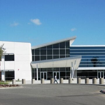The Student Center is an innovative high-performance building with optimum functionality and maximum flexibility. The 2-story structure is part of a five building project which includes a Maintenance and Operations Center, Sports Stadium, Field House, Campus Security building, and 500 car Parking Structure.